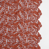 Allora Lace Throw Pillow | Autumn | A close-up of Allora fabric in the colorway, Autumn, a rich terracotta tone.