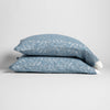 Allora Lace Pillowcase (Single) | Tahoe Blue | a pair of stacked cotton lace pillowcase covers on winter white liners against a white background.