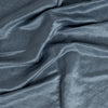 Paloma Crib Skirt | Tahoe Blue | a close up of charmeuse gently rumpled.