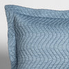 Cirillo Throw Pillow | Tahoe Blue | close up of the corner of a quilted cotton sateen pillow sham - shot against a white background.