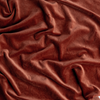 Harlow Blanket | Autumn | A close-up of Cotton Velvet fabric in the colorway, Autumn, a rich terracotta tone.