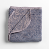 Georgia Blanket | French Lavender | folded blanket with its cotton jacquard side visible on the corner foldback against the chenille jacquard side.