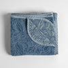 Georgia Blanket | Tahoe Blue | folded blanket with its cotton jacquard side visible on the corner foldback against the chenille jacquard side.