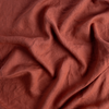 Linen Twin Fitted Sheets | Autumn | A close-up of Linen fabric in the colorway, Autumn, a rich terracotta tone.