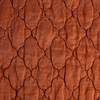 Luna Twin Coverlet | Autumn | A close-up of Luna fabric in the colorway, Autumn, a rich terracotta tone.