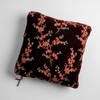 Autumn | A close-up of a Lynette Throw Pillow in Autumn, a rich terracotta tone, shown against a white background.