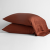 Madera Luxe Pillowcase (Single) | A pair of Madera Luxe pillowcases in Autumn, a rich terracotta tone, shown against a white background.