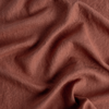 Austin Duvet Cover | Autumn | A close-up of Midweight Linen fabric in the colorway, Autumn, a rich terracotta tone.