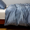 Paloma Duvet Cover | Tahoe Blue | charmeuse duvet cover and matching sham from the Paloma collection - side view.