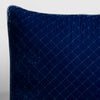 Tahoe Blue | A close-up of a corner of a Silk Velvet Quilted Throw Pillow in Tahoe Blue, a saturated blue like a crystal clear sky, shown against a white background. 