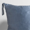 Taline Sham | Tahoe Blue | close up of a charmeuse pillow corner and tassel against a white background.