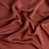 Madera Luxe Twin Flat Sheet | Autumn | a close up of tencel fabric in autumn, a rich terracotta tone.