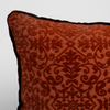 Autumn | A close-up of the corner of a Vienna Throw Pillow in Autumn, a rich terracotta tone, shown against a white background.