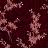 Lynette Yardage | Poppy | A close up of embroidered silk velvet fabric in poppy, a warm coral pink.