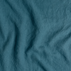 Midweight Linen Yardage | Cenote | A close up of midweight linen fabric in cenote, a vibrant, ocean-inspired blue-green.