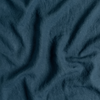 Midweight Linen Yardage | Midnight | A close up of midweight linen fabric in midnight, a rich indigo tone.