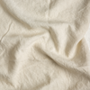 Midweight Linen Yardage | Parchment | A close up of midweight linen fabric in parchment, a warm, antiqued cream.