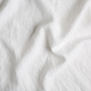 Midweight Linen Yardage | White | A close up of midweight linen fabric in classic white.